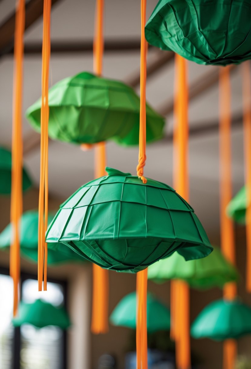 Green turtle shell decorations hanging from the ceiling with orange strings in a children's birthday party setting.