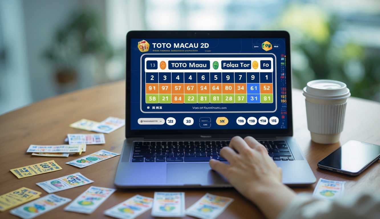 Meja kerja dengan laptop menampilkan antarmuka lotere digital, tiket lotere, ponsel, dan secangkir kopi.