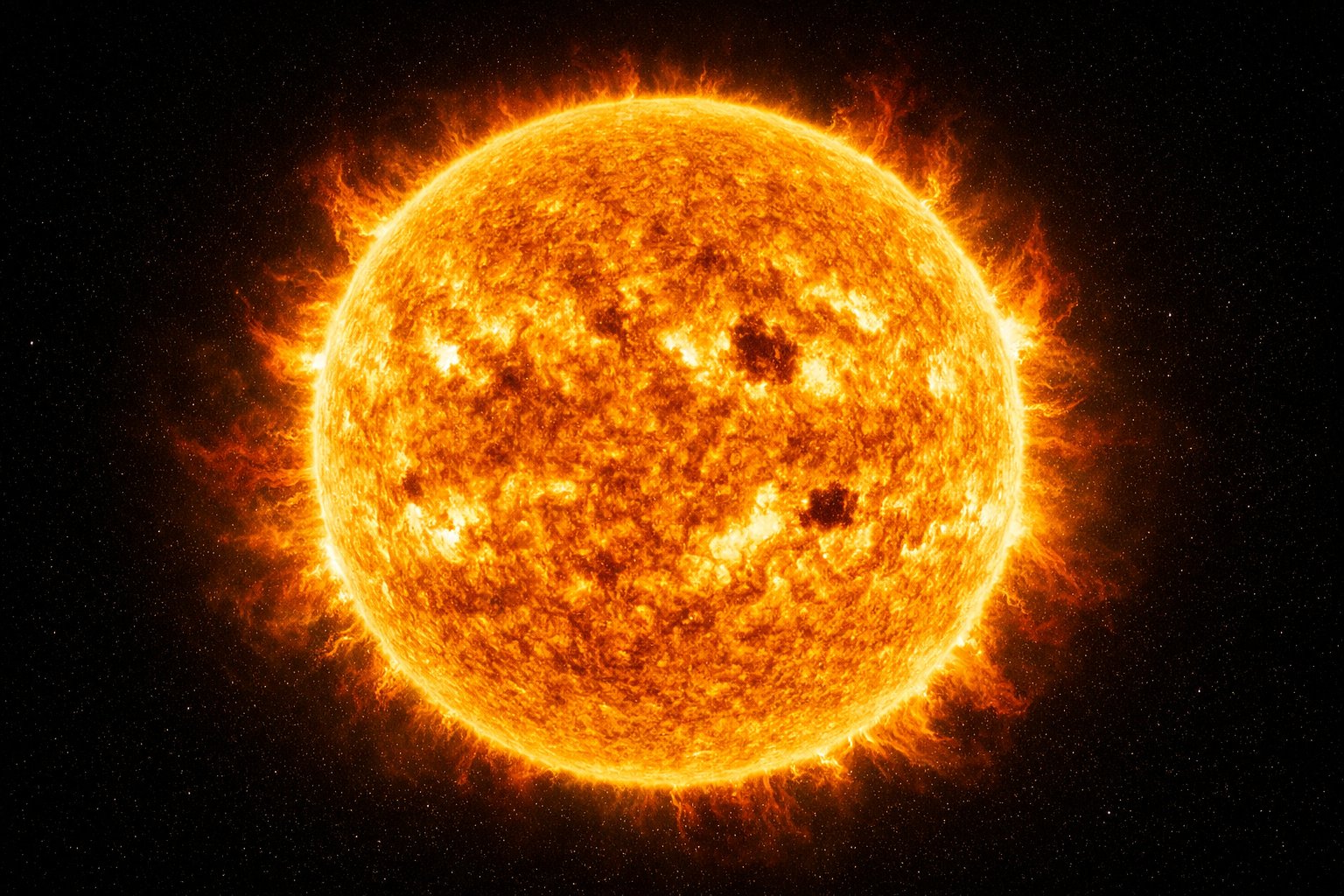 Slika Sunca s vidljivim solarnim bakljama i pjegama na njegovoj površini na crnoj pozadini svemira.