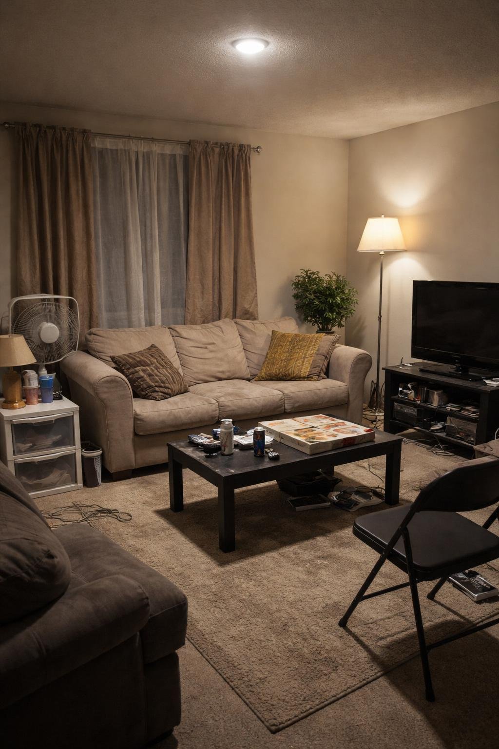 A living room with poor lighting showing cheap and mismatched furniture and decor, creating a dull and uninviting atmosphere.