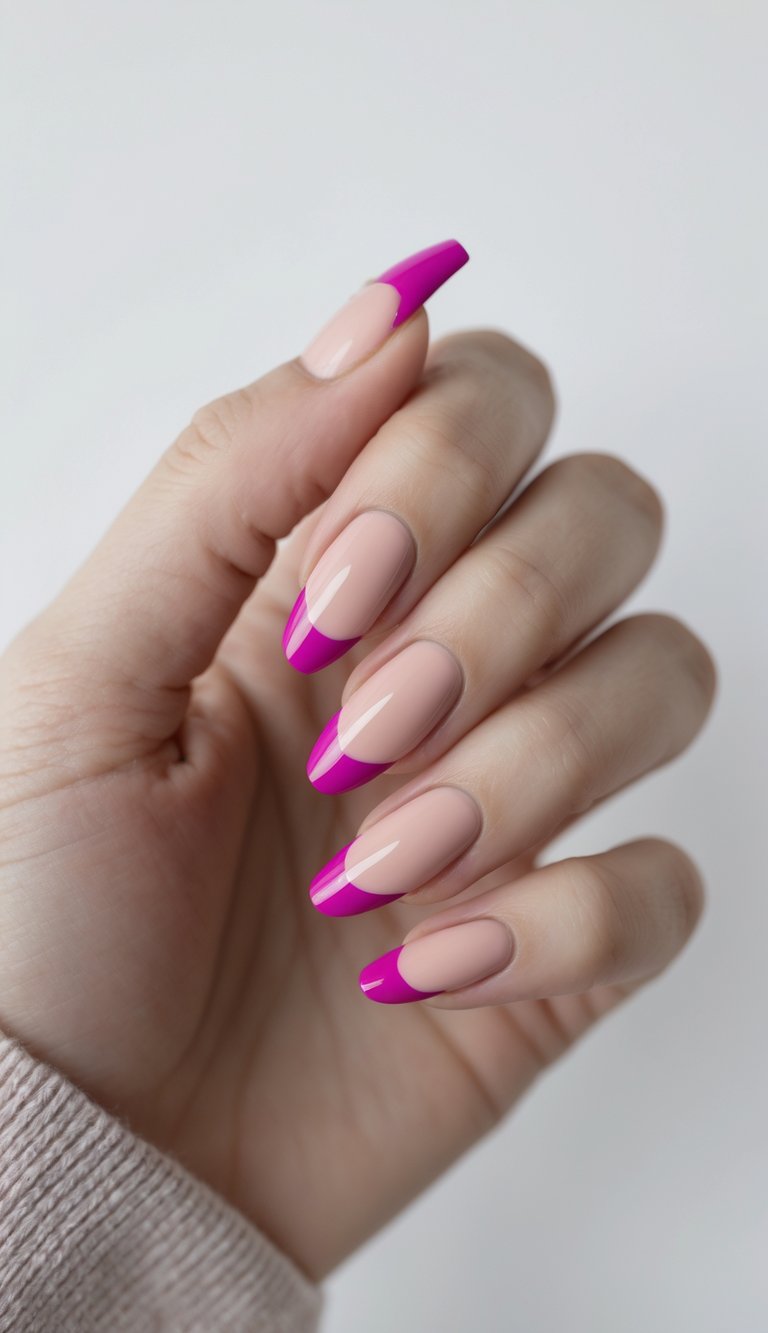 Close-up of one hand showing nails painted with a blush nude base and magenta side French tips against a white background.