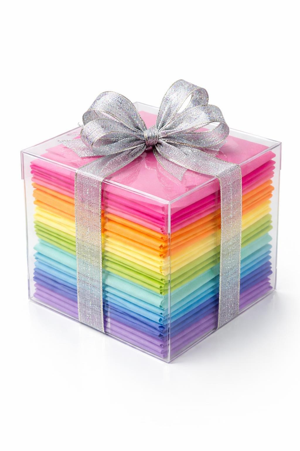 Clear PVC gift box filled with layered colorful tissue paper and topped with a metallic bow.