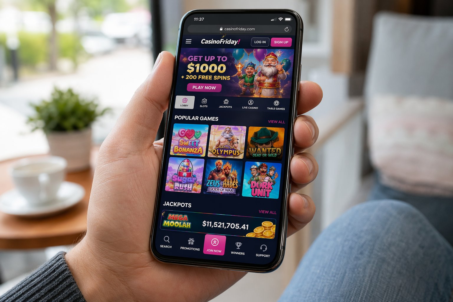 Person Holding A Smartphone Showing A Casino Game With Slot Machines And Poker Chips On The Screen.
