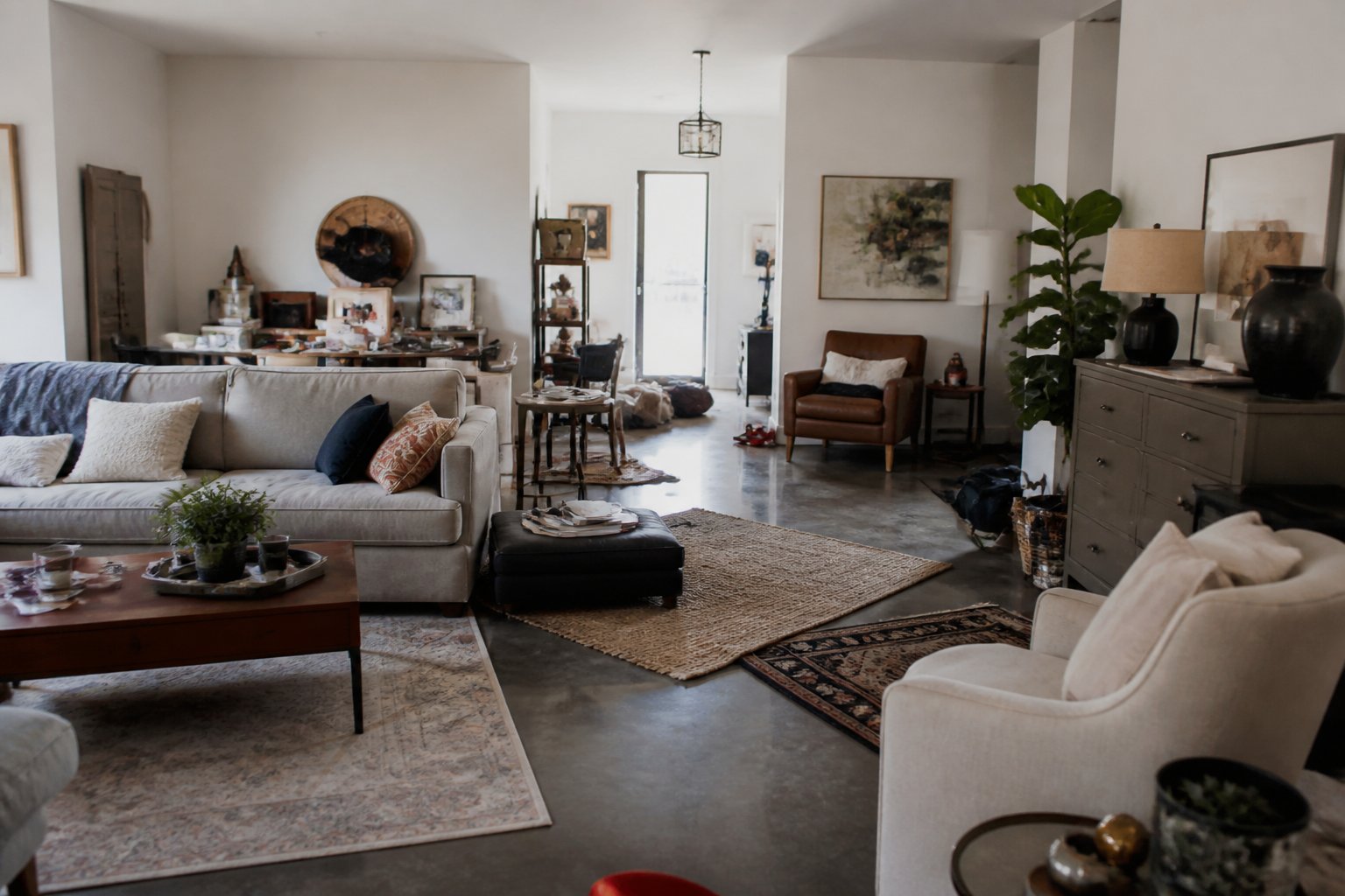 A cluttered living room with mismatched furniture and scattered decorations creating a disorganized and uncoordinated space.
