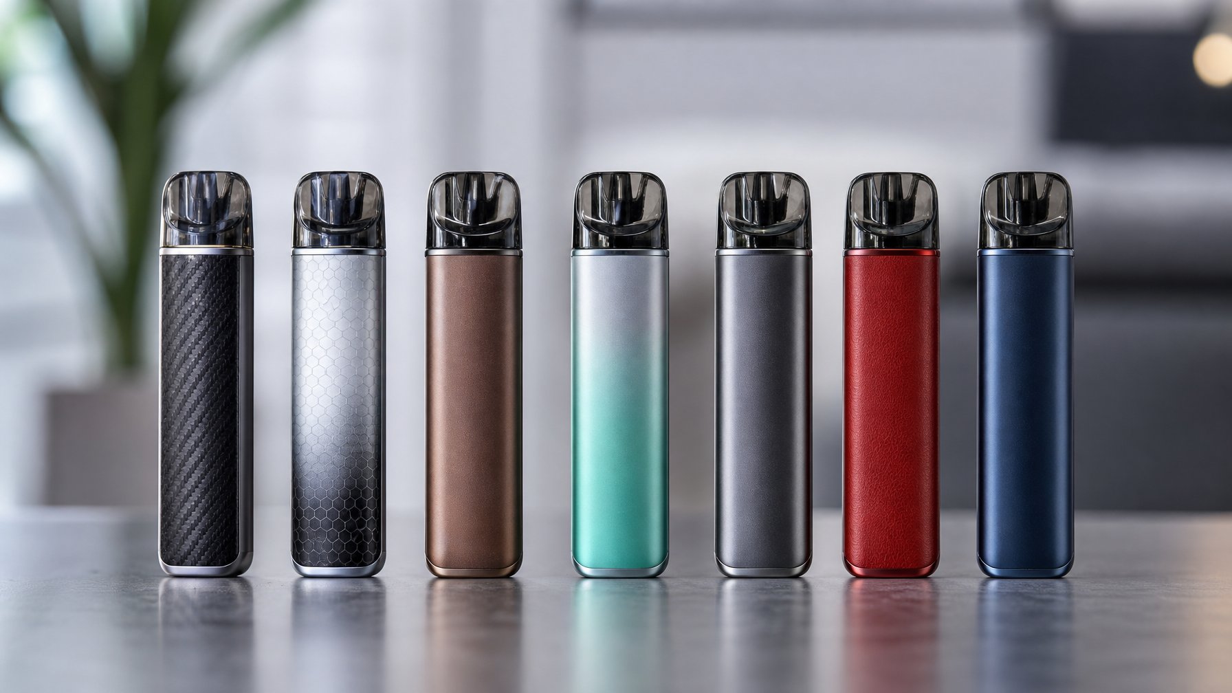 Beberapa perangkat vape terbaru dengan desain modern dan warna berbeda tersusun rapi di atas permukaan bersih.