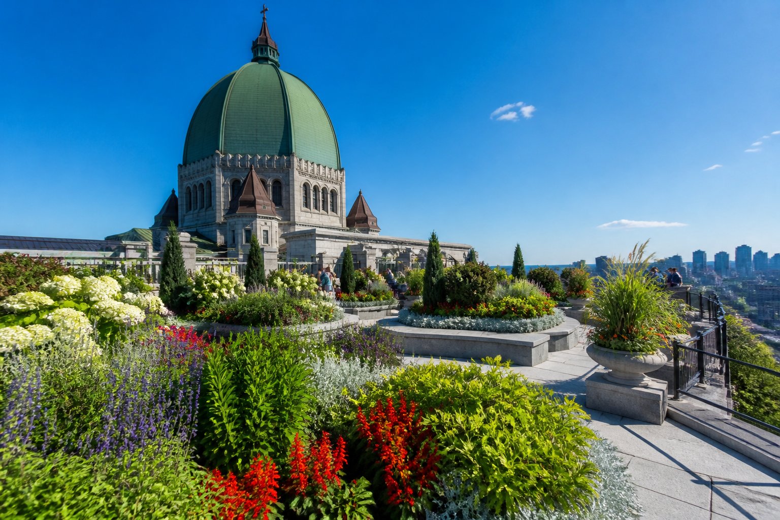 Rooftop gardens with flowers and greenery atop Saint Joseph's Oratory, with the dome and Montreal city skyline in the background.
