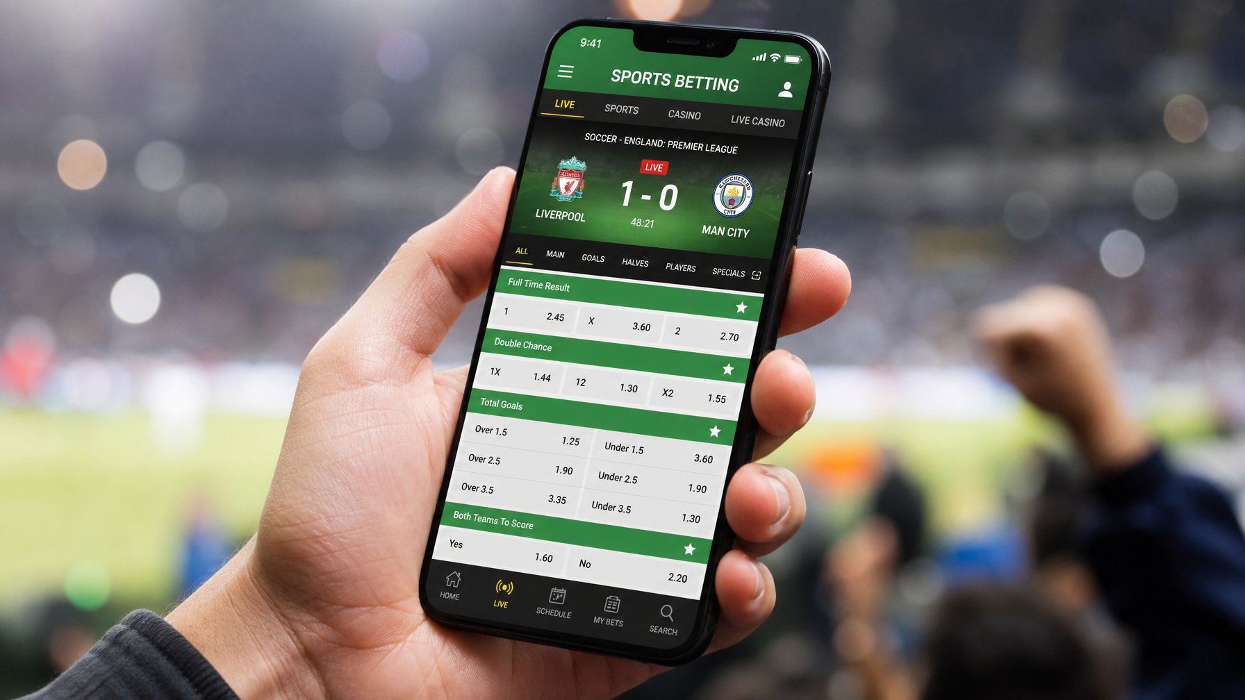 Seseorang memegang smartphone yang menampilkan aplikasi taruhan bola dengan tampilan antarmuka yang jelas dan mudah digunakan.