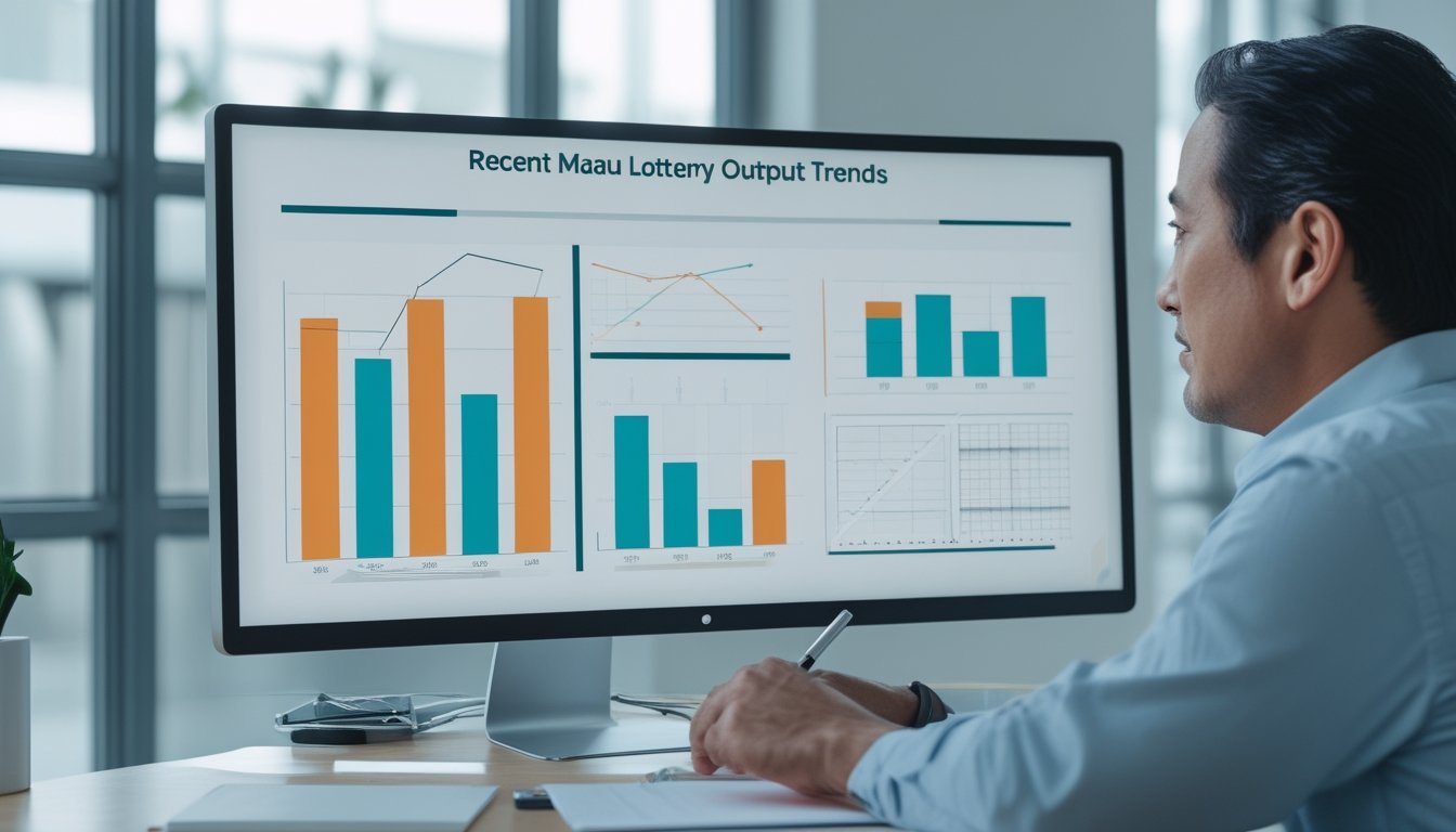 Seorang analis mempelajari grafik abstrak di monitor sambil mencatat di meja kerja.