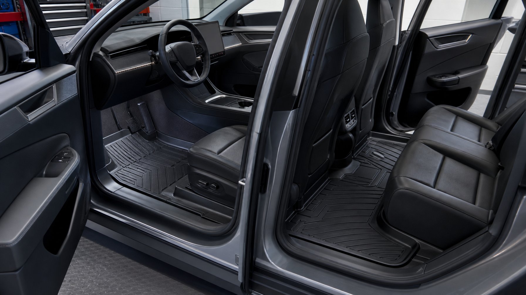 Karpet pelindung khusus terpasang rapi di lantai kabin mobil listrik dalam bengkel modern.