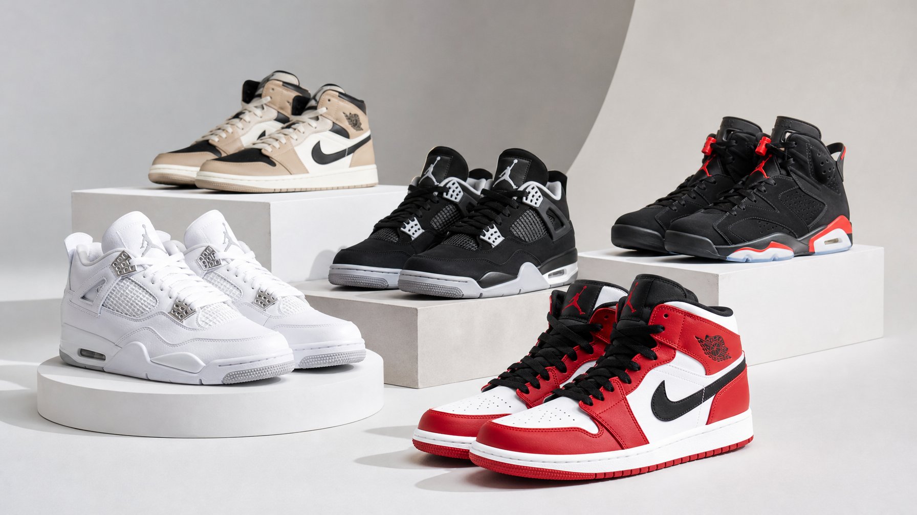 Beberapa pasang keranjang sepatu Air Jordan tersusun rapi di atas dudukan dalam ruang studio terang.
