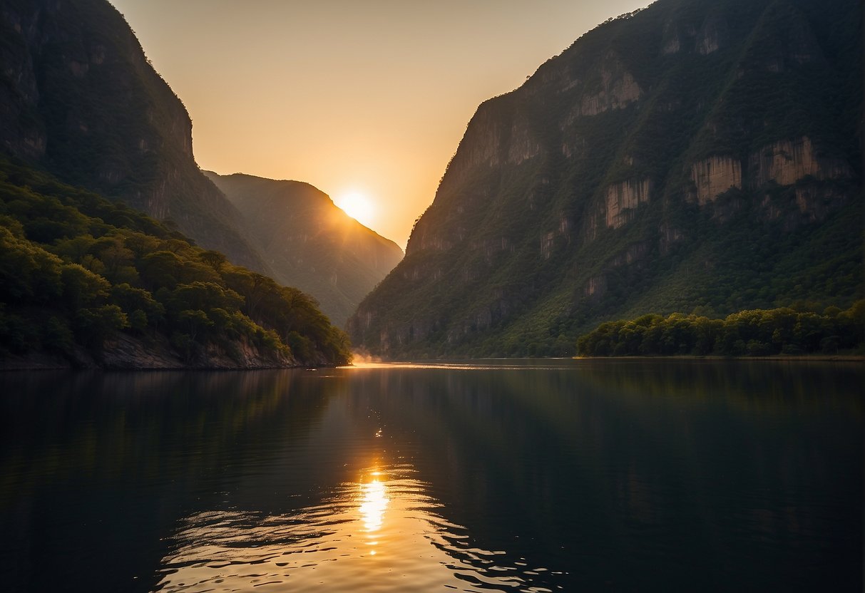The sun sets behind the towering walls of Sumidero Canyon, casting a warm glow on the rugged cliffs and reflecting off the tranquil waters below