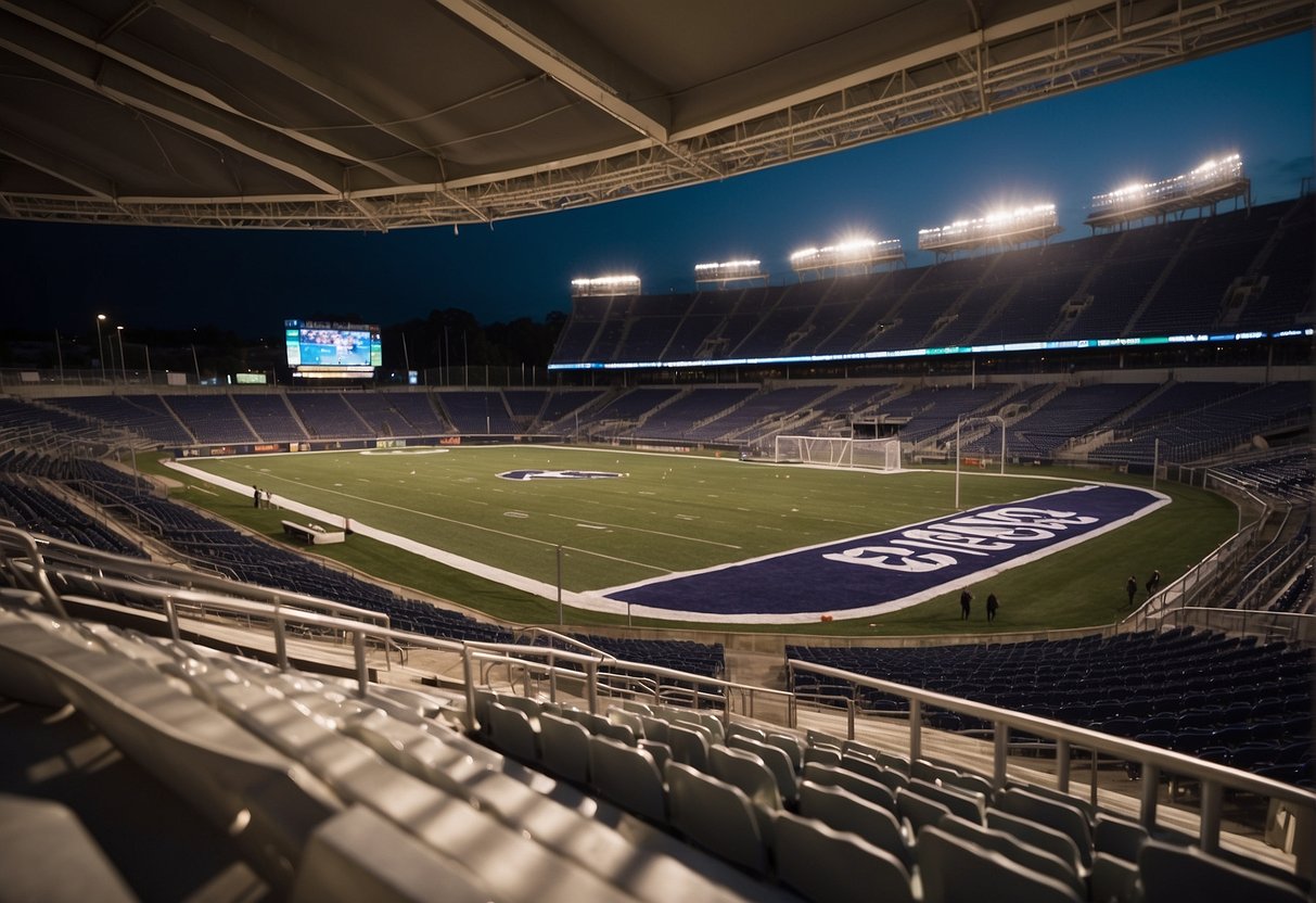 An outdoor stadium with tiered seating, a large playing field, and open-air design. Multiple entrances, team logos, and concession stands visible