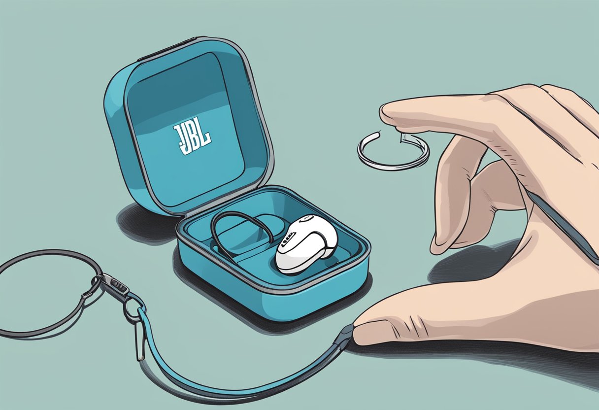 A hand reaches for a small case labeled "JBL Earbuds" sitting on a table. The case is attached to a keychain, ensuring it won't get lost