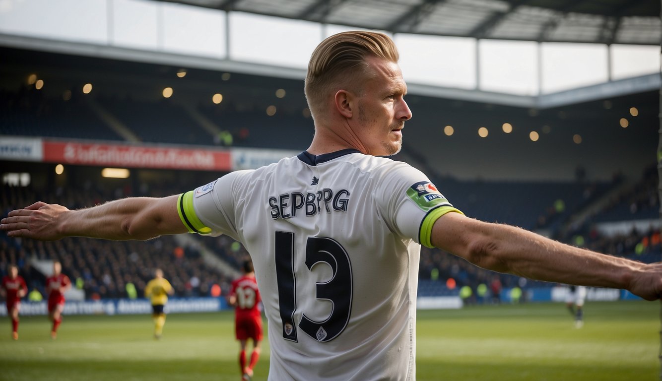 Sepp van den Berg in a Preston North End jersey, on the pitch, with a Liverpool logo visible