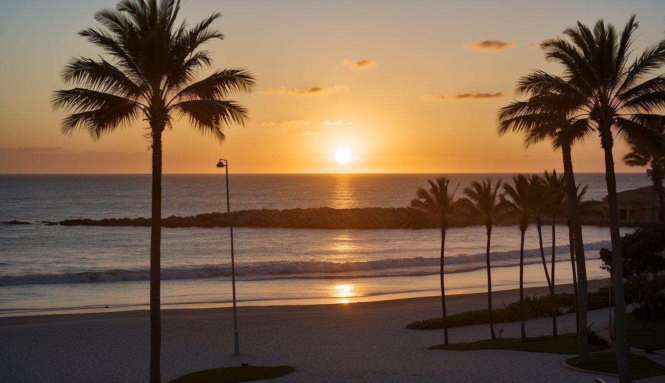 The sun sets over the calm ocean, casting a warm glow on the Embassy Suites Deerfield Beach, with palm trees swaying in the gentle breeze