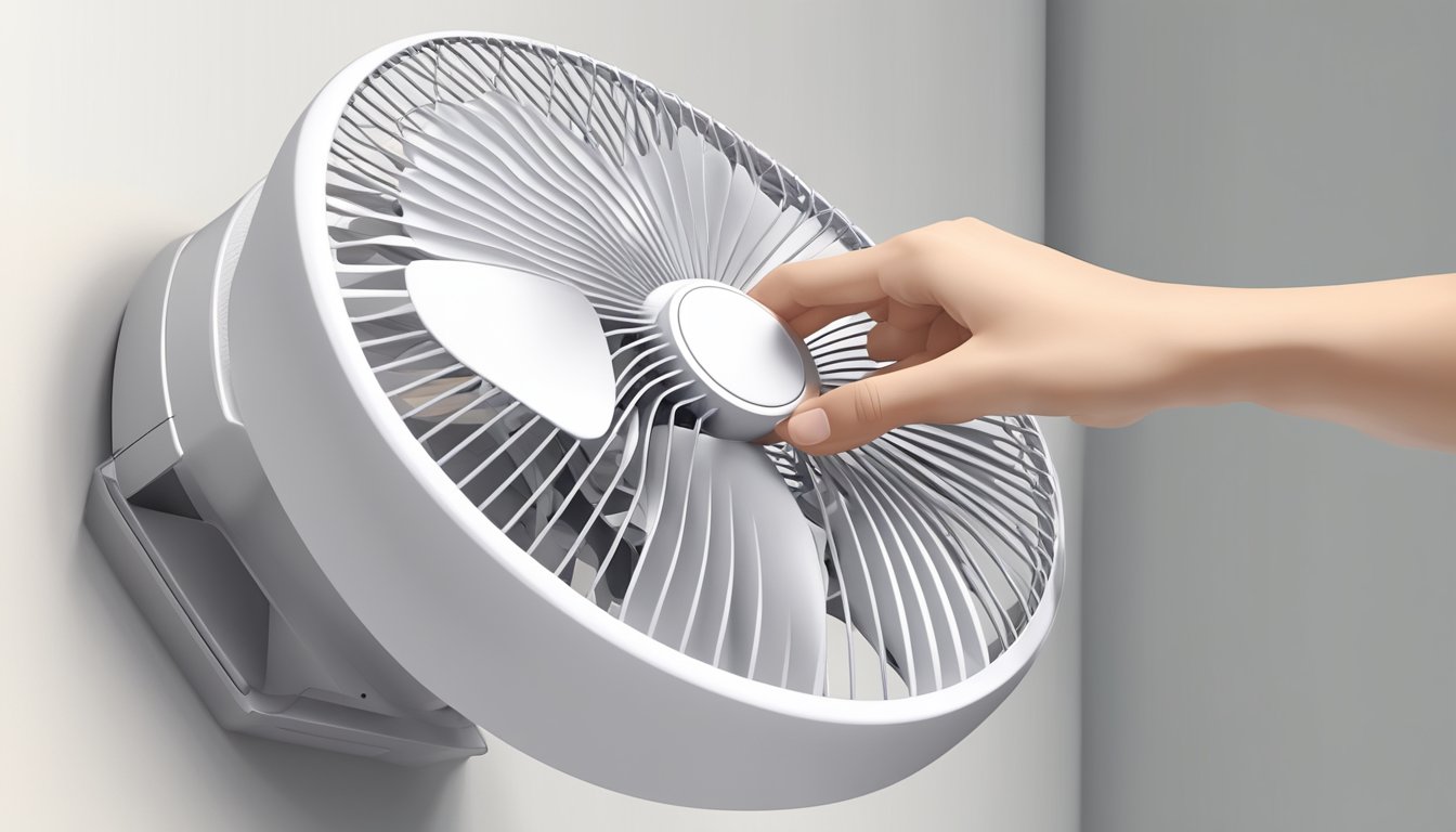 A hand reaches out to adjust the speed dial on a sleek, modern wall fan. It is mounted on a clean, white wall, casting a gentle breeze