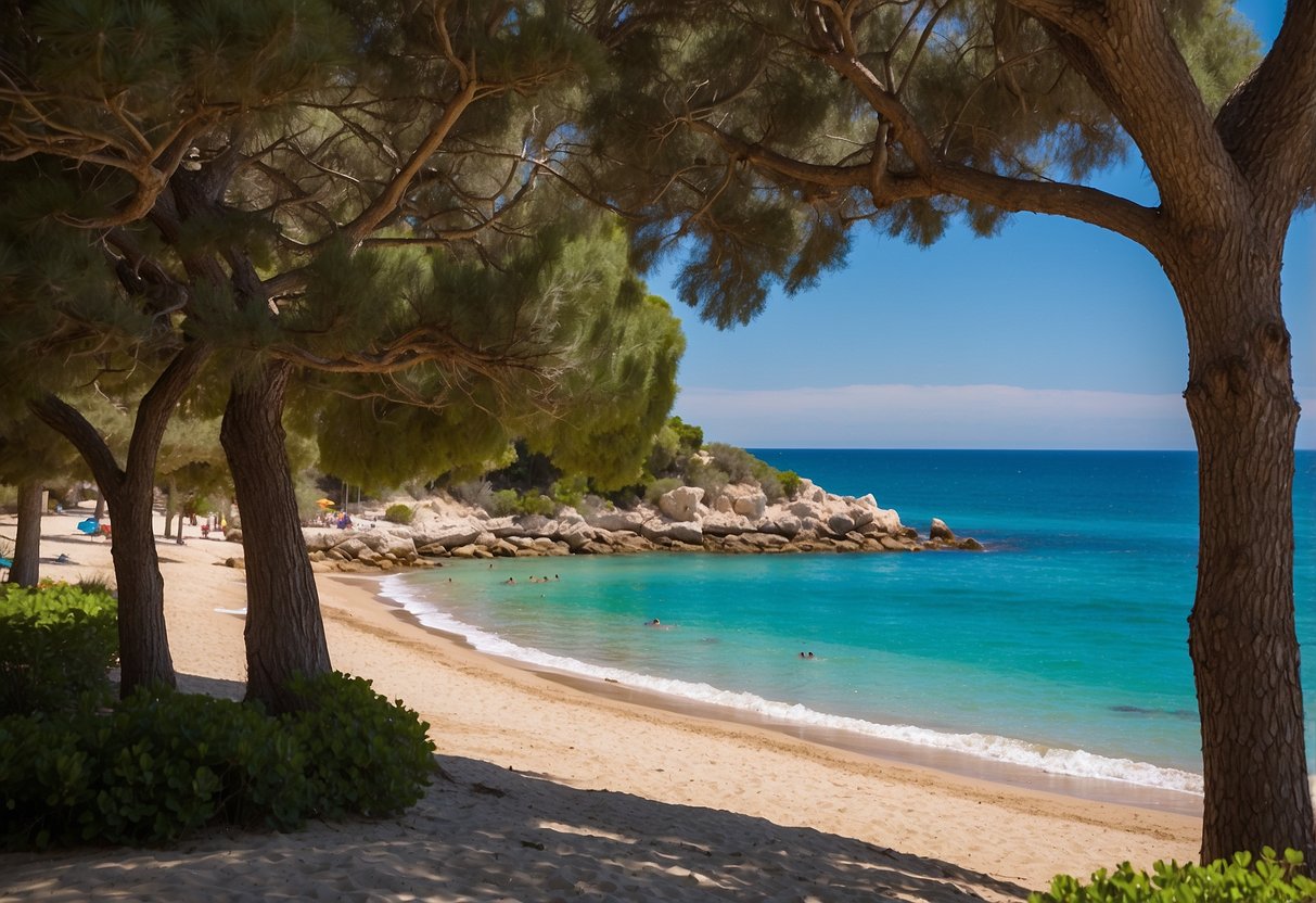 A sandy beach with crystal-clear blue waters, bordered by lush greenery and a clear blue sky at Strand und Meer Riva di Ugento Camping Resort