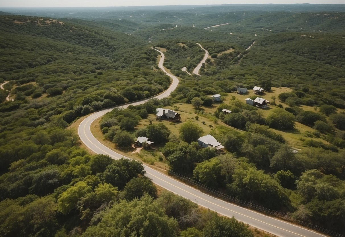 Aerial view of Texas hill country with tiny homes clustered together, surrounded by lush greenery and winding pathways