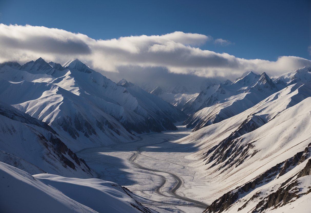 A rugged ridge cuts through the snowy expanse of Denali, with jagged peaks and sweeping valleys creating a dramatic alpine landscape