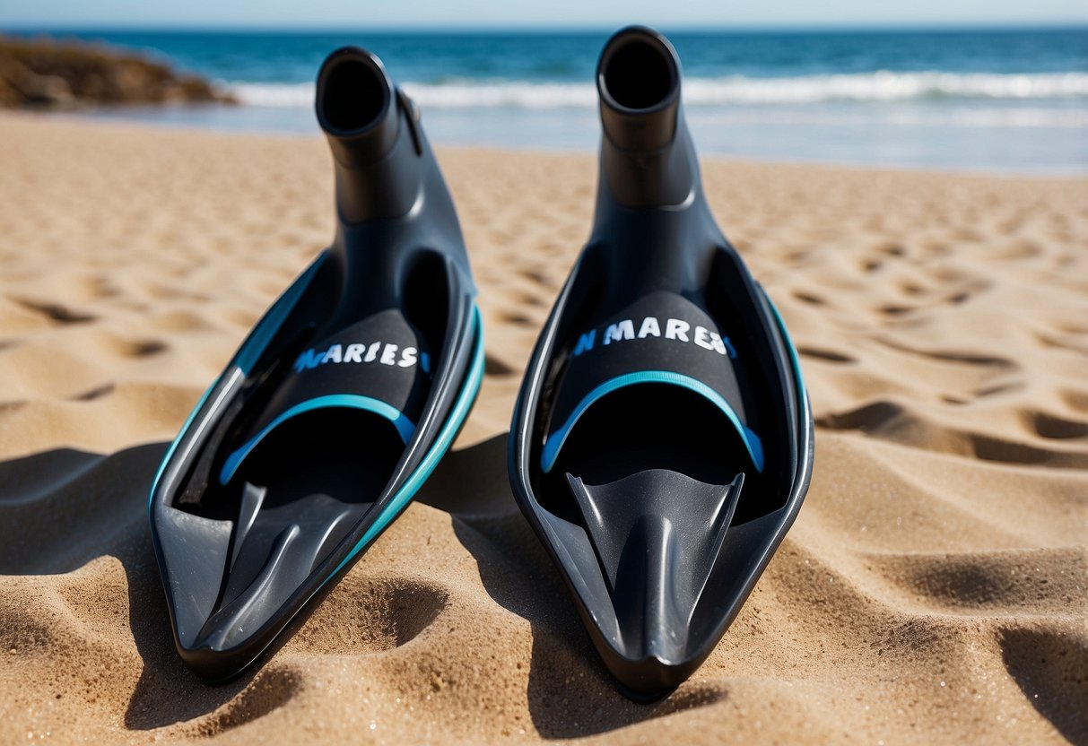 A pair of Mares Pure Instinct 3mm pants lying on a sandy beach next to a pair of diving fins and a snorkel, with the ocean in the background