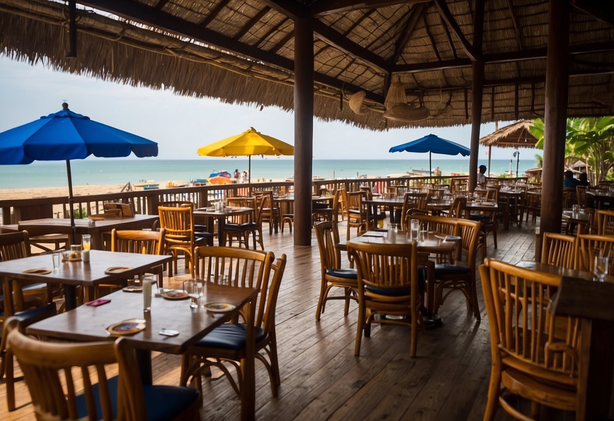 A bustling Koh Lanta restaurant with colorful umbrellas, wooden tables, and a view of the beach. Customers enjoy fresh seafood and tropical cocktails