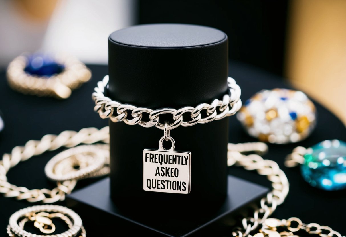 A chain bracelet with a "Frequently Asked Questions" charm dangles from a display stand, surrounded by other jewelry items