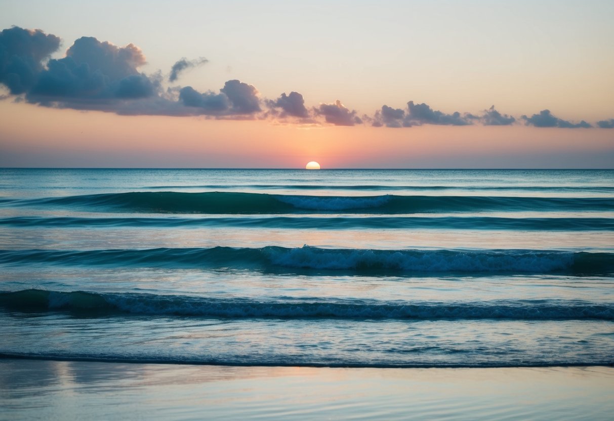 A tranquil beach at sunset, with gentle waves and a clear aquamarine sky reflecting on the water