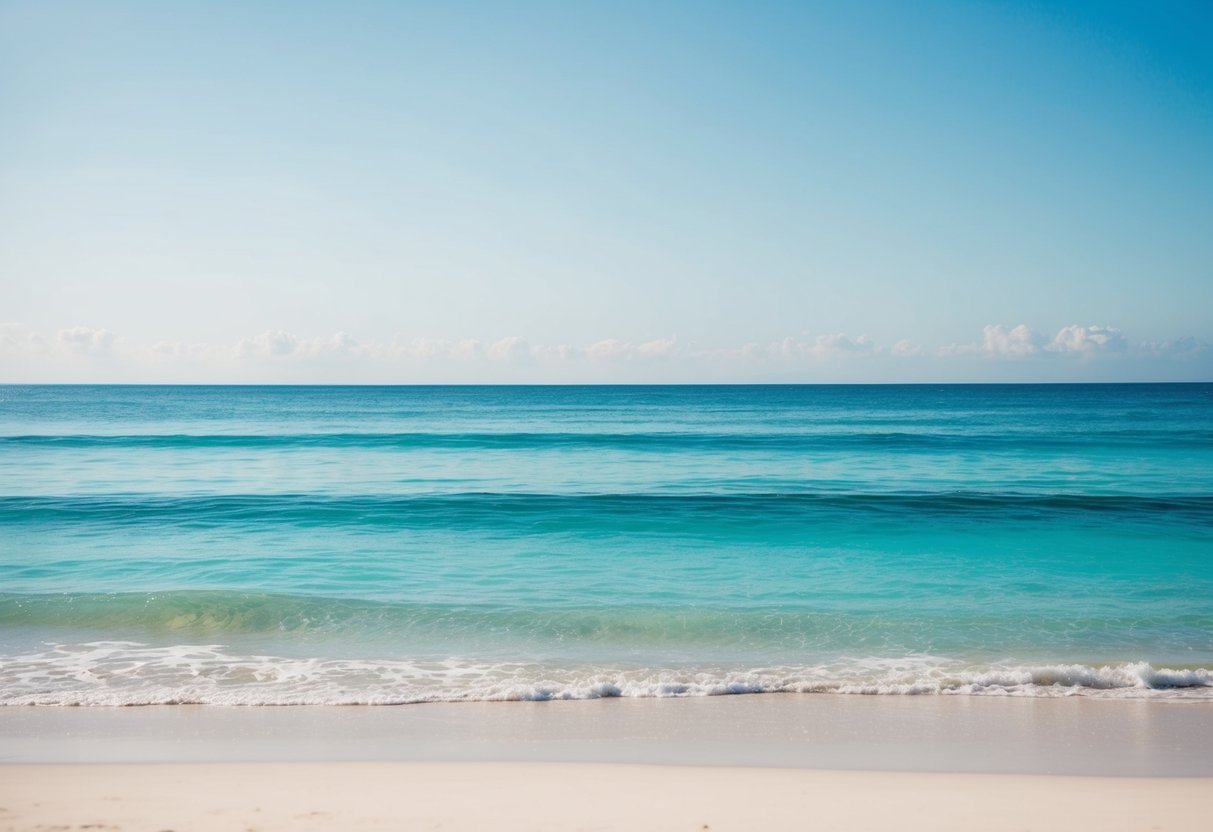 A tranquil beach scene with clear aquamarine waters, gentle waves, and a cloudless sky. A sense of calm and peace emanates from the serene atmosphere