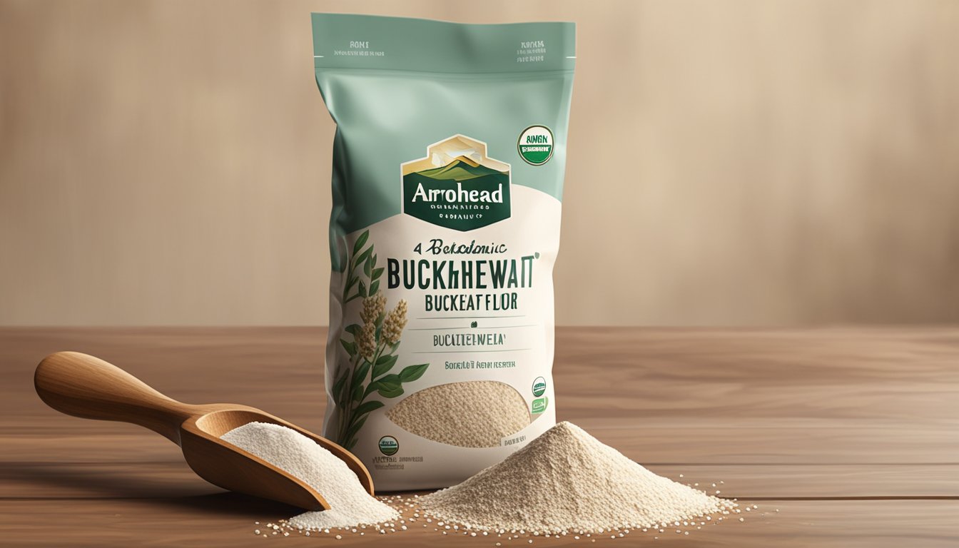 A bag of Arrowhead Mills organic buckwheat flour sits on a wooden kitchen counter, surrounded by a scattering of buckwheat grains and a rustic wooden spoon