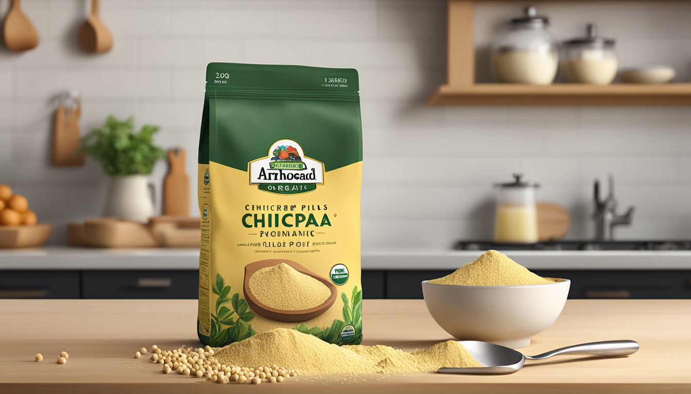 A bag of Arrowhead Mills Organic Chickpea Flour sitting on a wooden kitchen counter, surrounded by scattered chickpeas and a small metal scoop