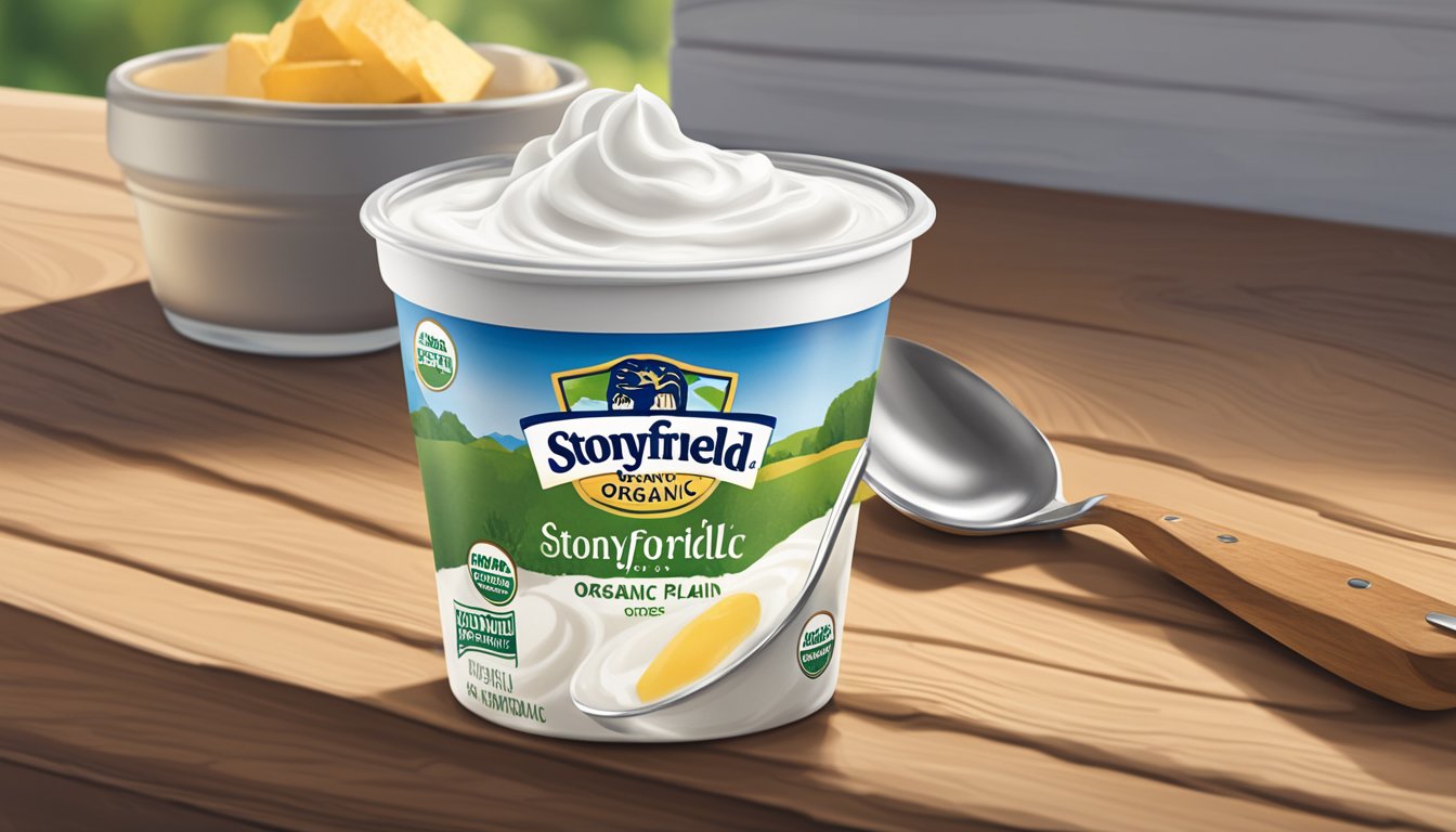 A bowl of Stonyfield organic Greek plain nonfat yogurt with a spoon resting beside it on a rustic wooden table