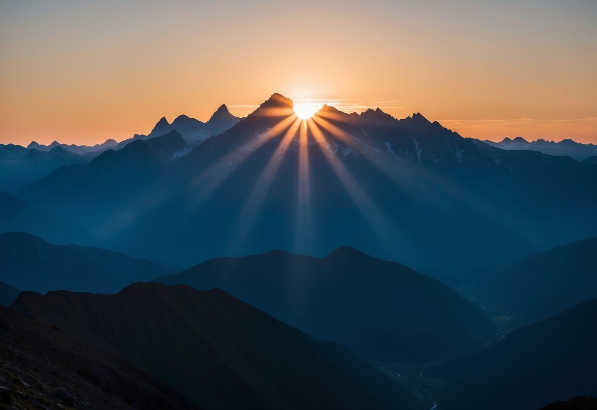 A mountain range with a sun rising behind it, casting long shadows and creating a stark contrast between the peaks and valleys below