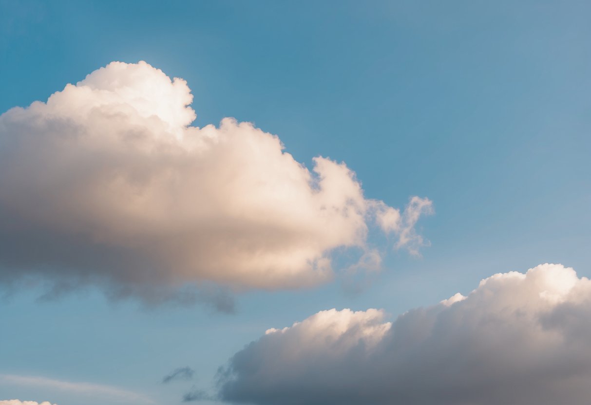 Two clouds gently touch, creating a soft, fleeting connection in the sky