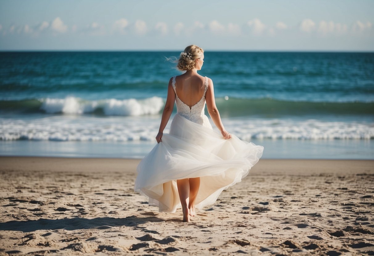 A bride standing barefoot on a sandy beach, looking out at the ocean with her wedding dress flowing in the breeze