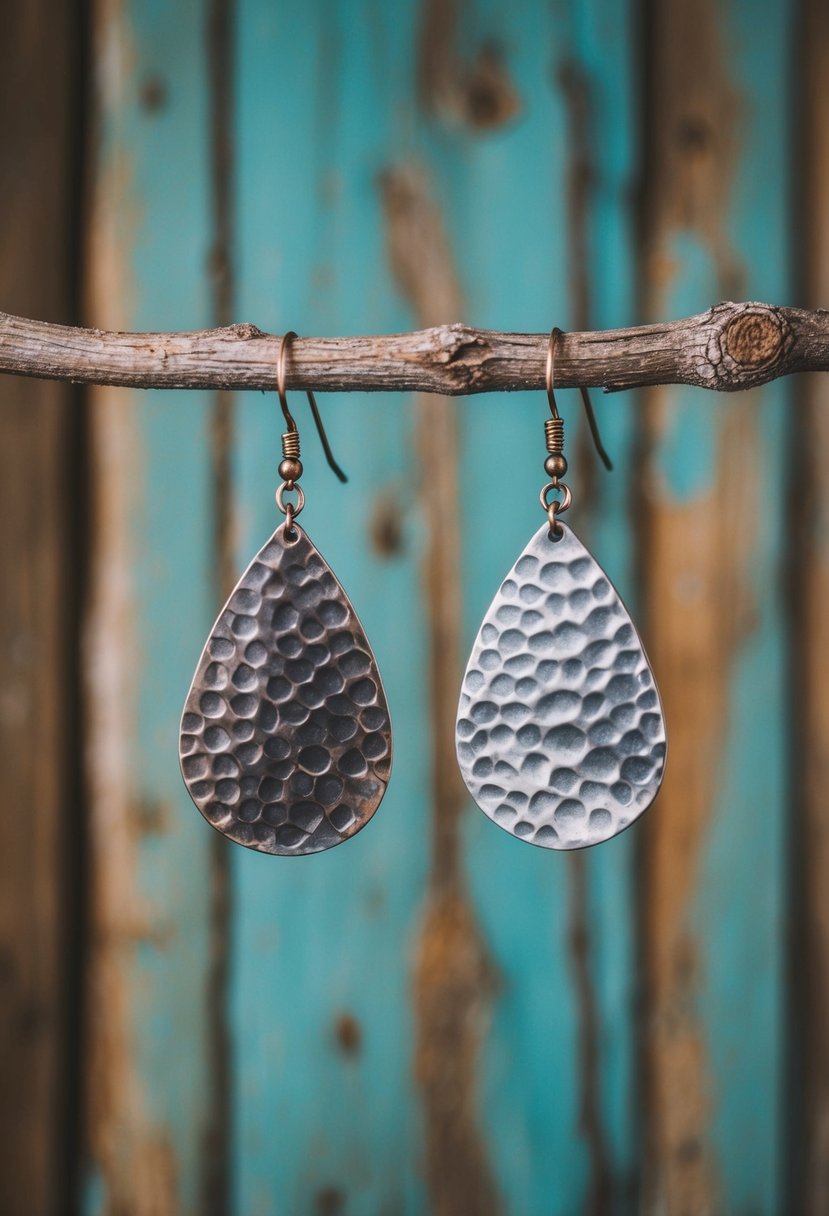 Rustic metal earrings hanging against a weathered wood backdrop, with soft lighting to highlight the hammered texture