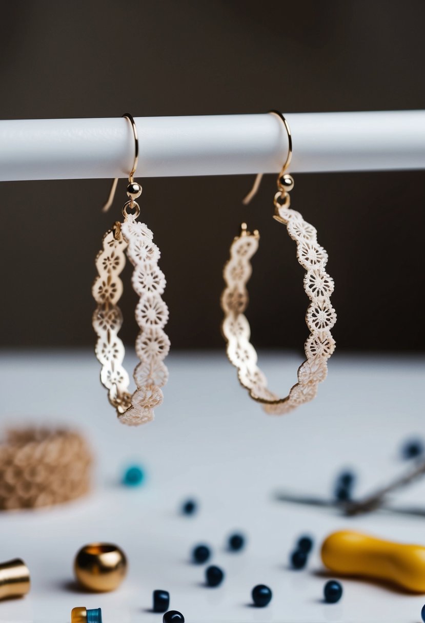 A pair of delicate lace pattern hoop earrings suspended in mid-air, surrounded by scattered beads and small tools on a white table