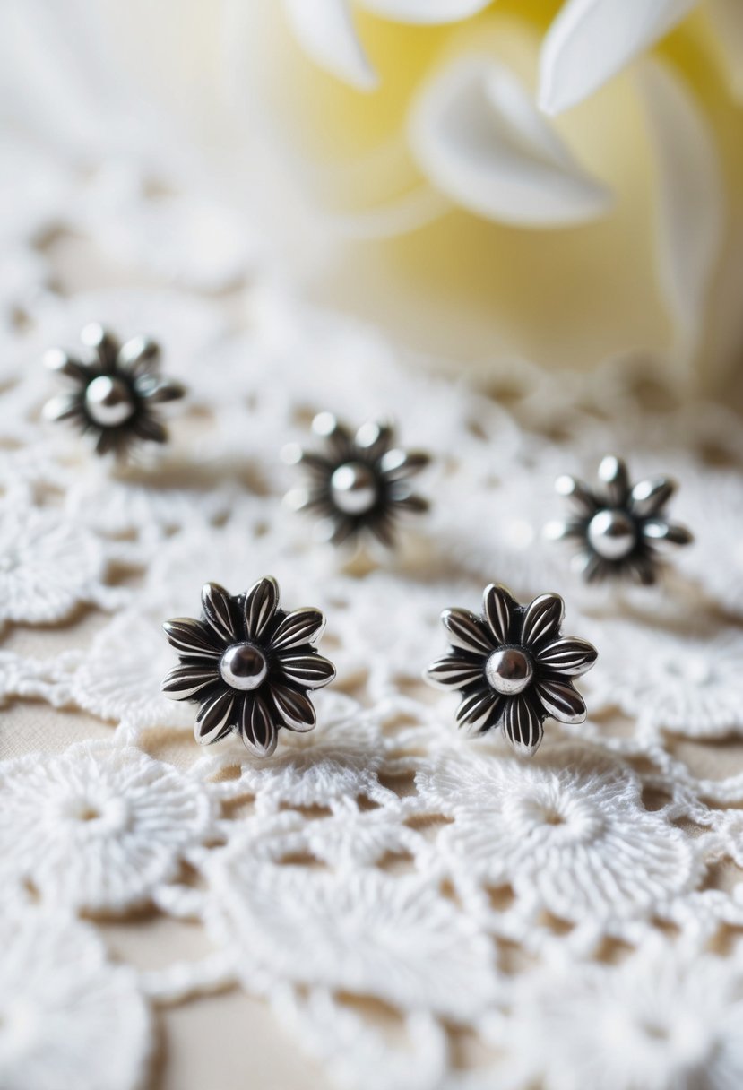 A close-up view of delicate silver floral studs on a white lace background, with soft natural lighting highlighting the intricate details