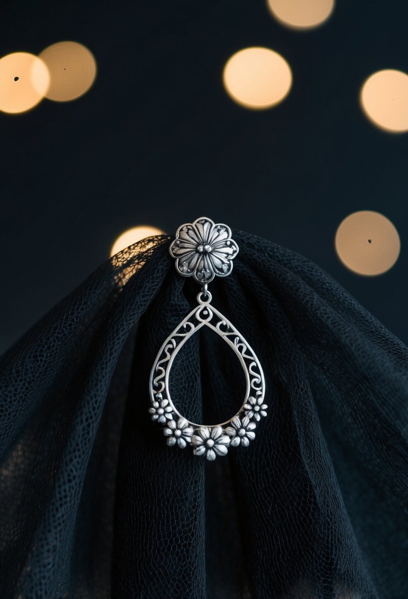 A black lace veil drapes over a silver earring with intricate floral details, set against a dark background