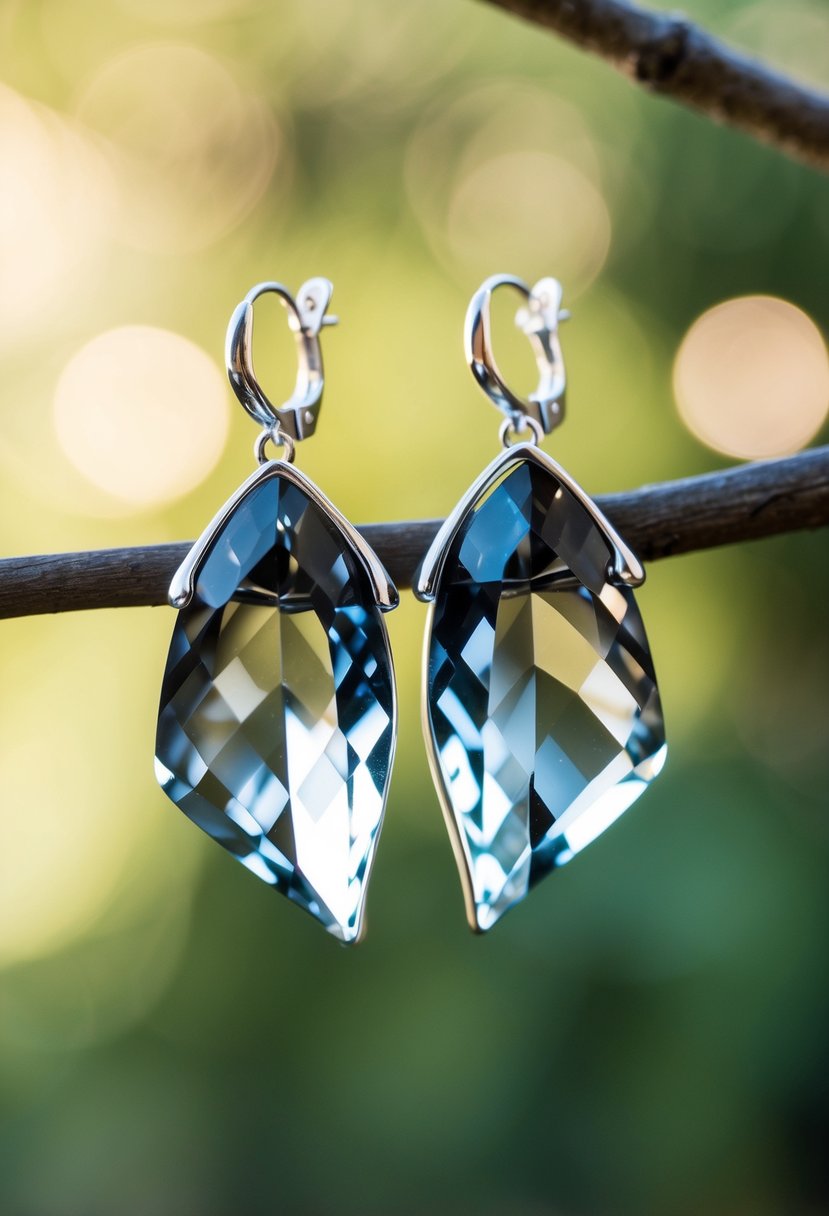 A pair of smokey gray quartz crystal earrings delicately shaped like butterfly wings, sparkling in the sunlight