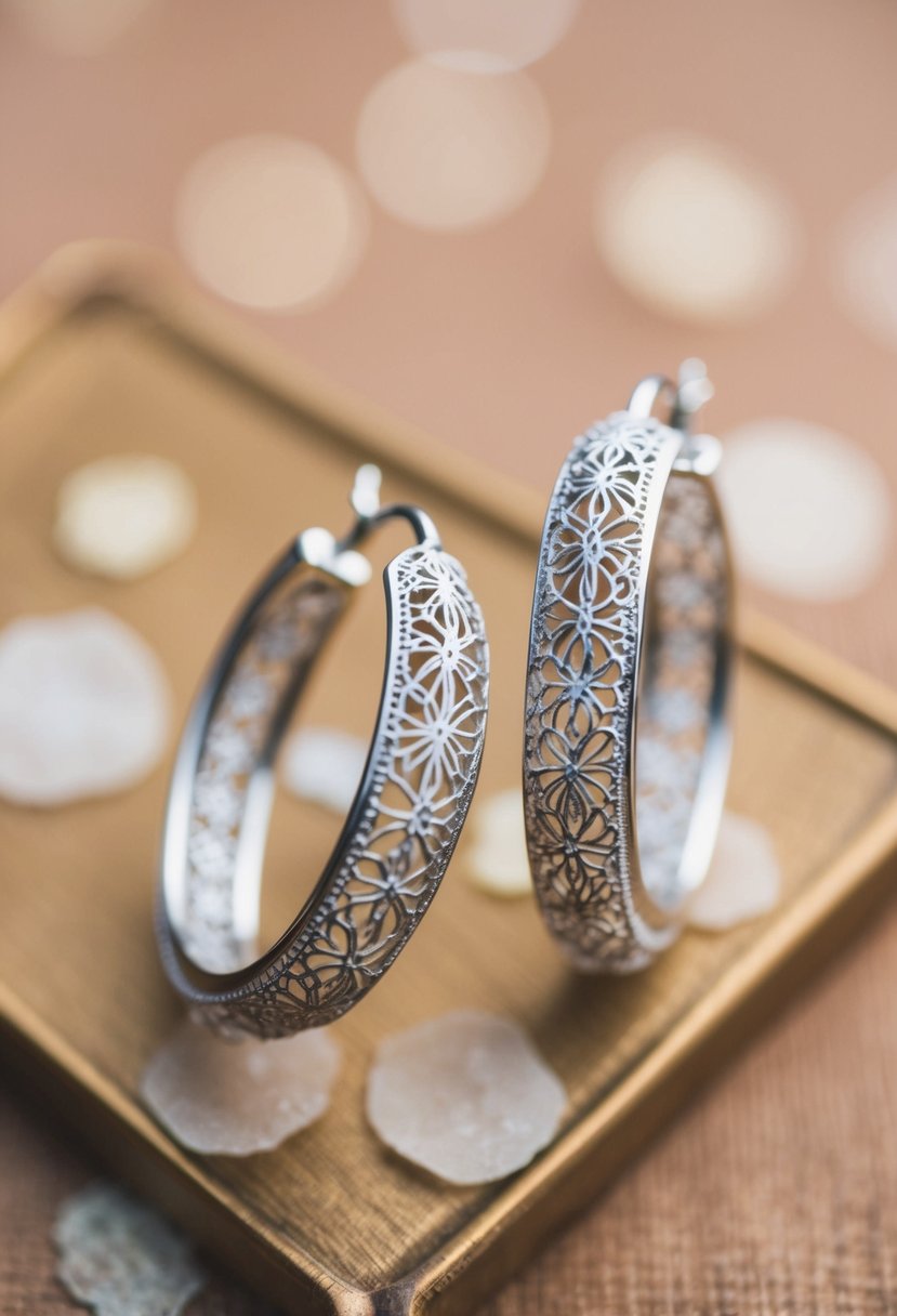 A pair of lace-patterned hoop earrings from the 1920s, with intricate details and delicate design, perfect for a vintage wedding