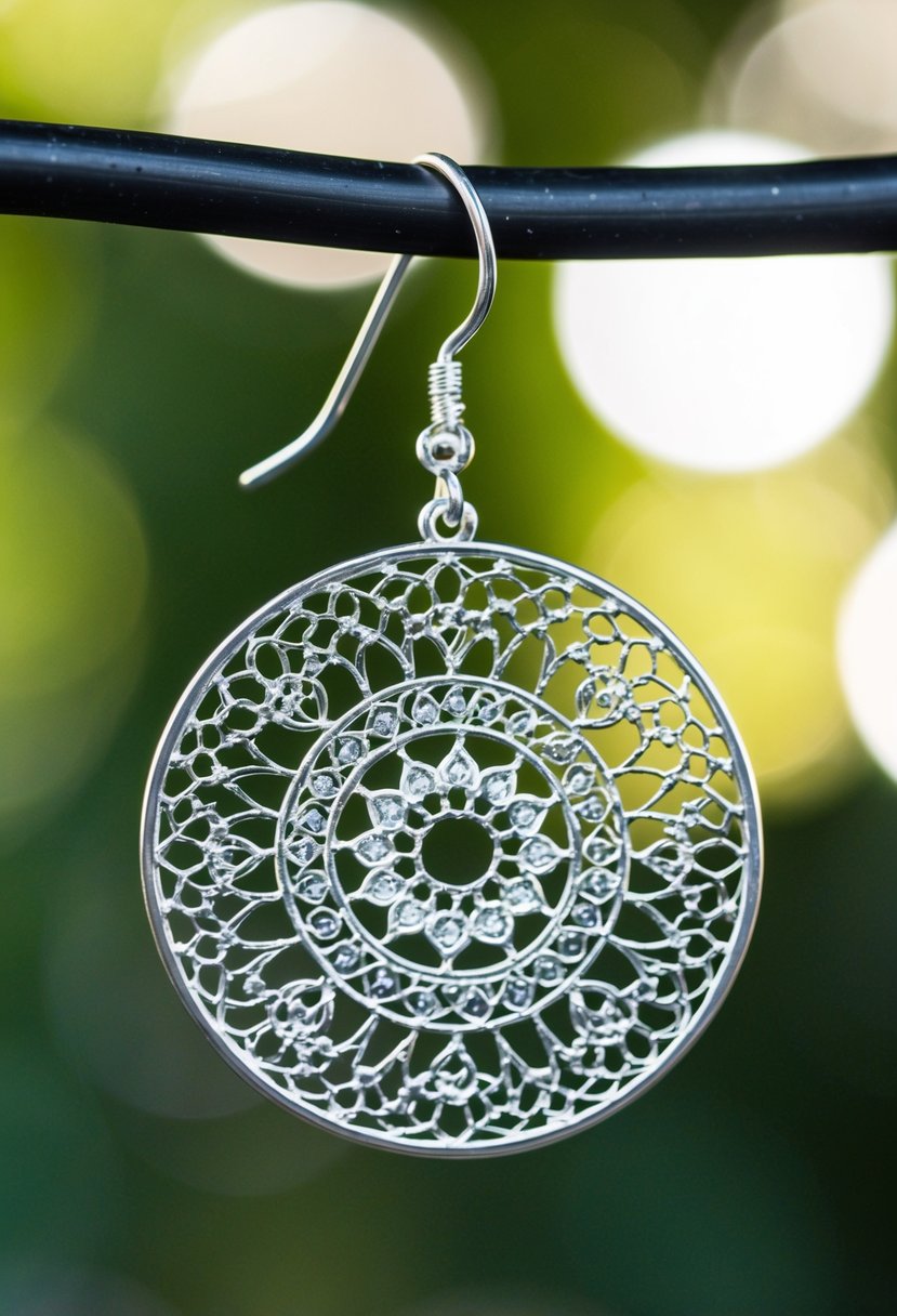 Delicate filigree silver circles dangle from a hook, catching the light with intricate patterns