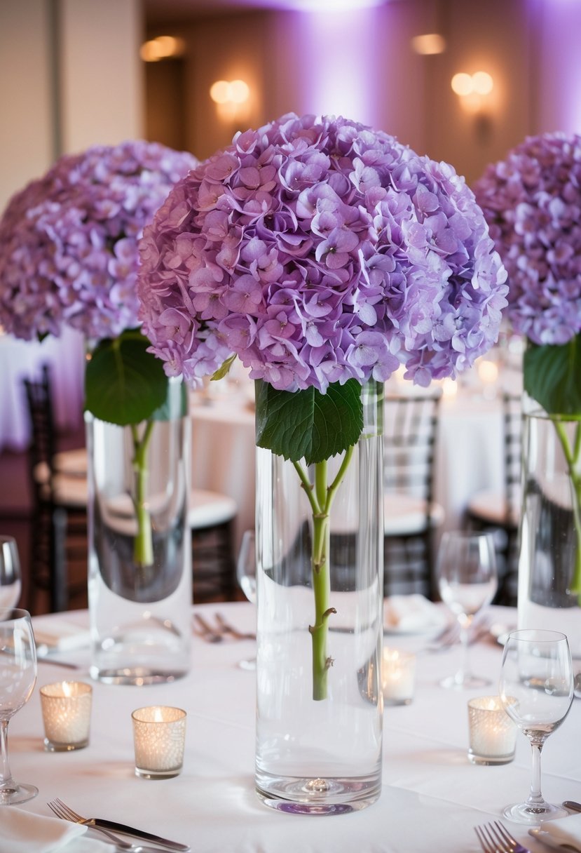 Tall glass vases filled with purple hydrangeas arranged on a wedding reception table