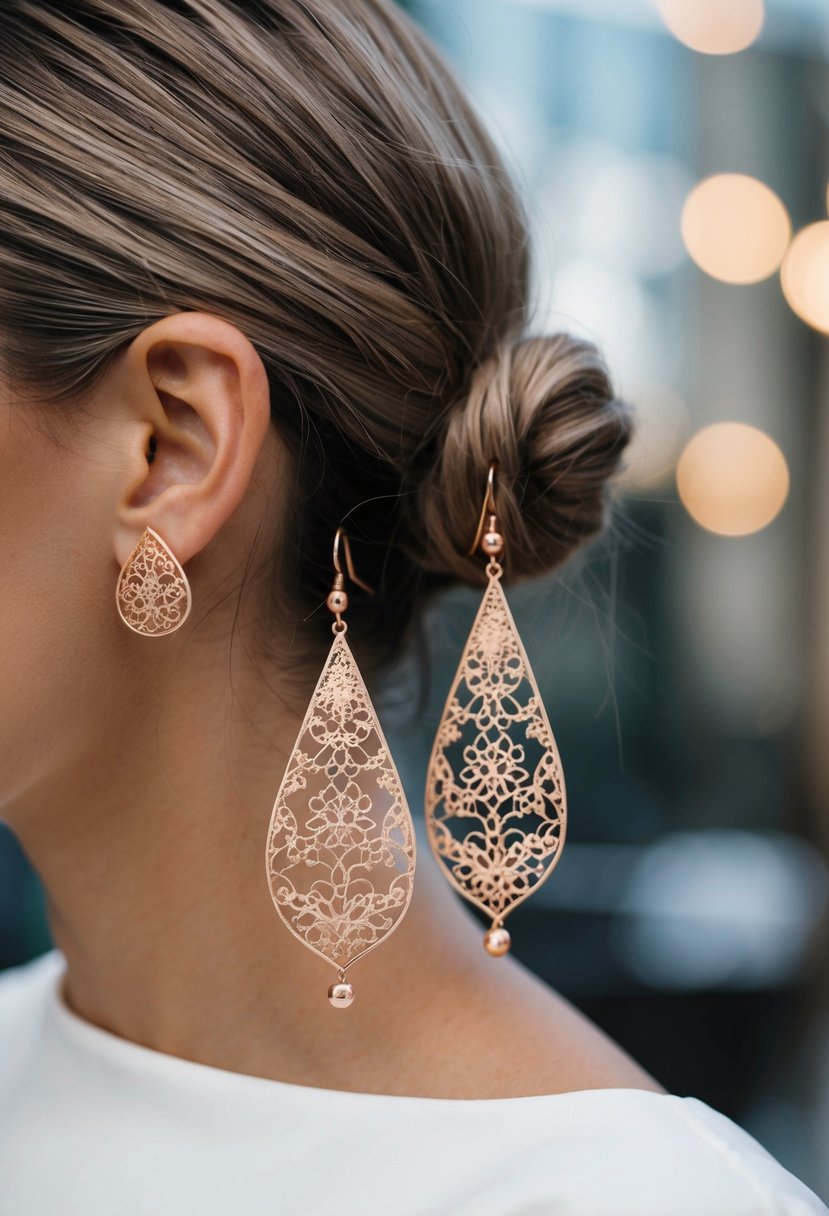 A pair of rose gold filigree drop earrings dangle elegantly from a low bun hairstyle