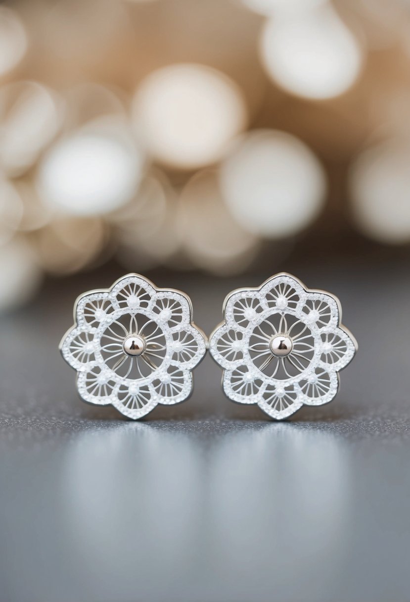 A pair of delicate lace-inspired white gold earrings, with intricate details and a timeless, elegant design