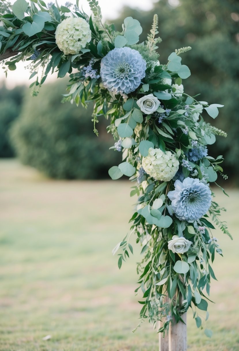 A floral arch with dusty blue and sage green flowers and foliage