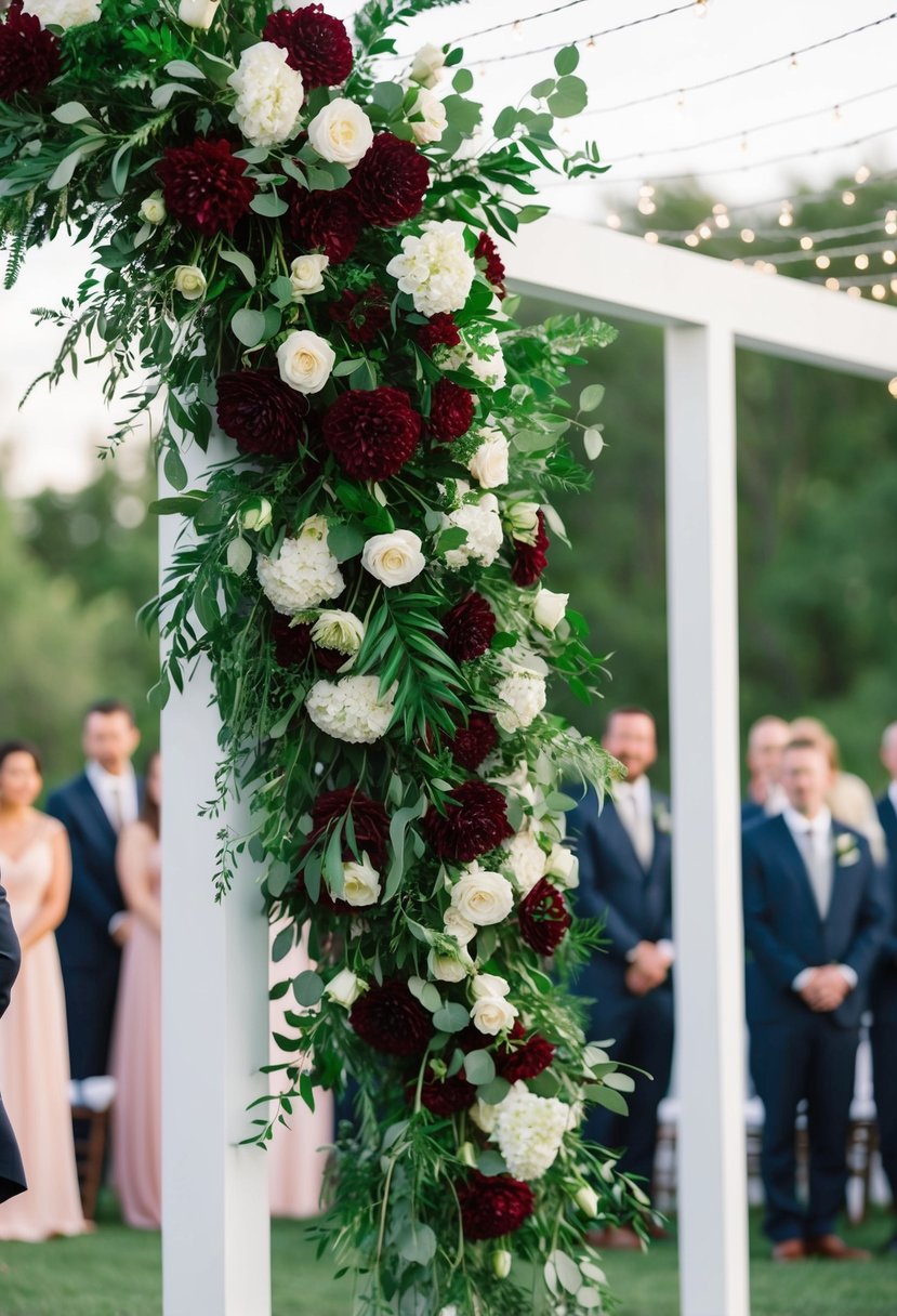 Lush emerald and wine red florals cascading from a wedding arch