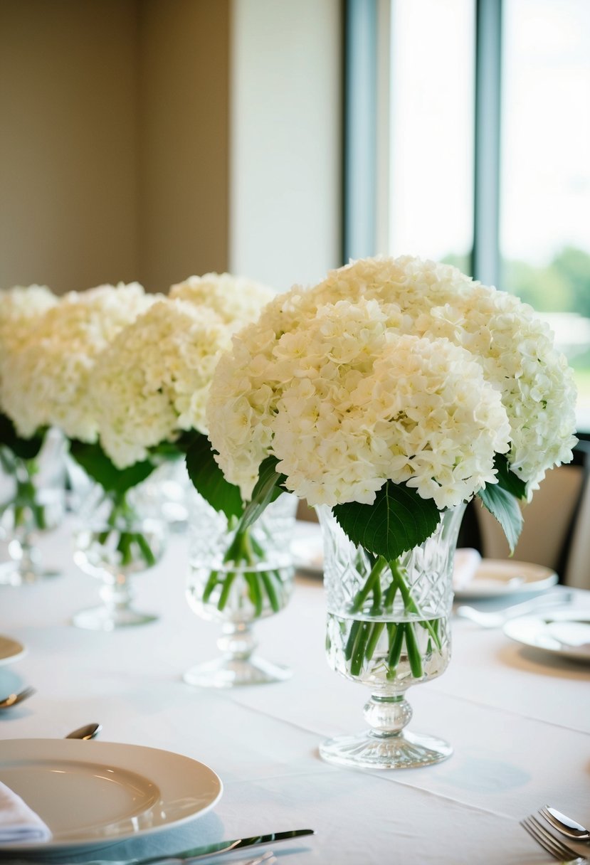 White hydrangeas arranged in crystal vases on a simple wedding table