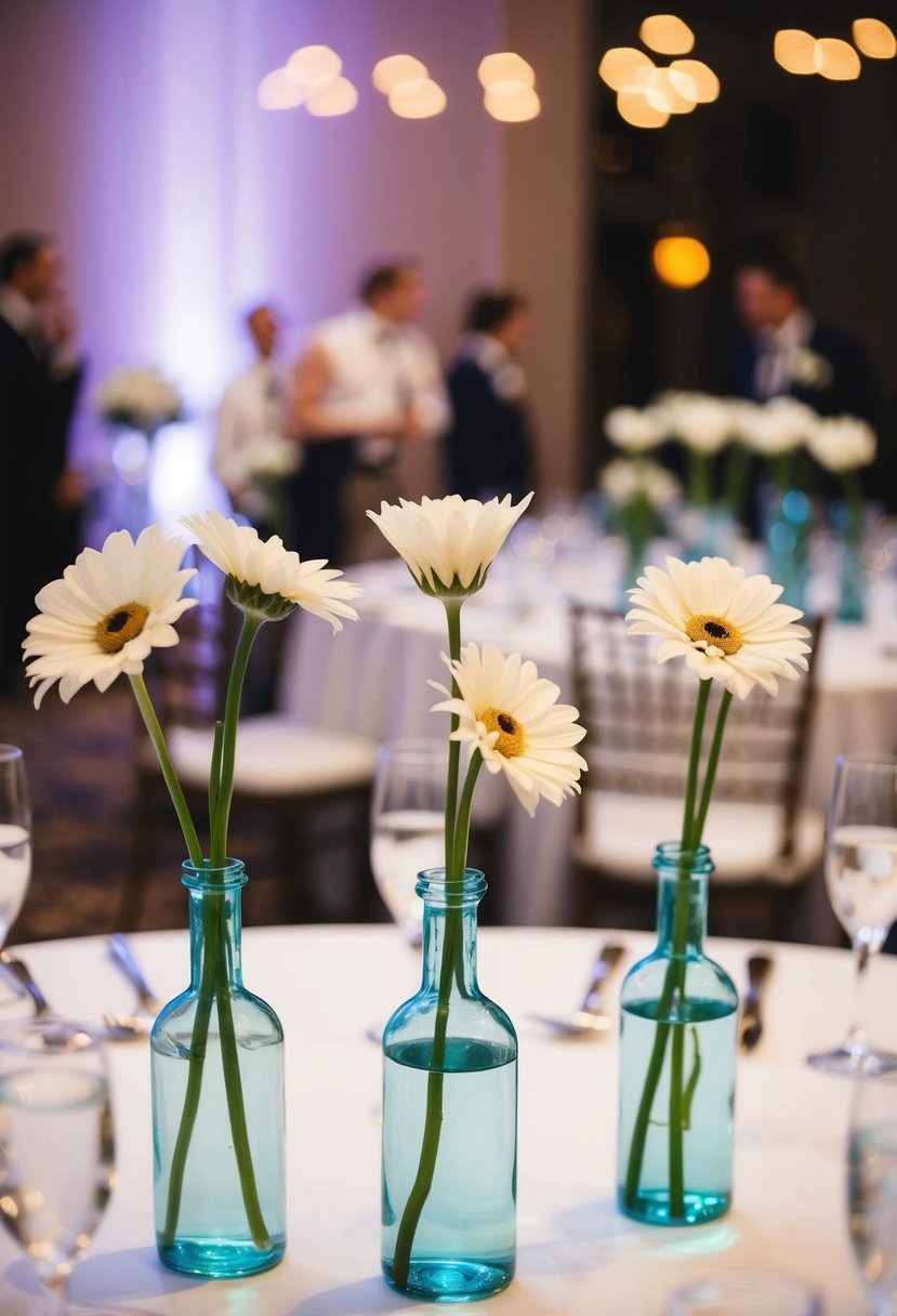 Several bud vases with single-stem flowers arranged on a wedding reception table