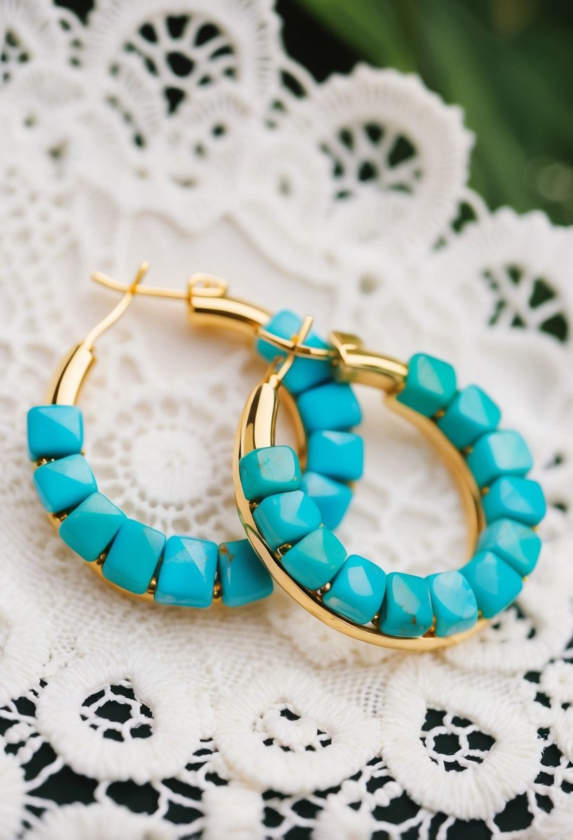 Gold-plated hoops with synthetic turquoise stones arranged on a white lace background