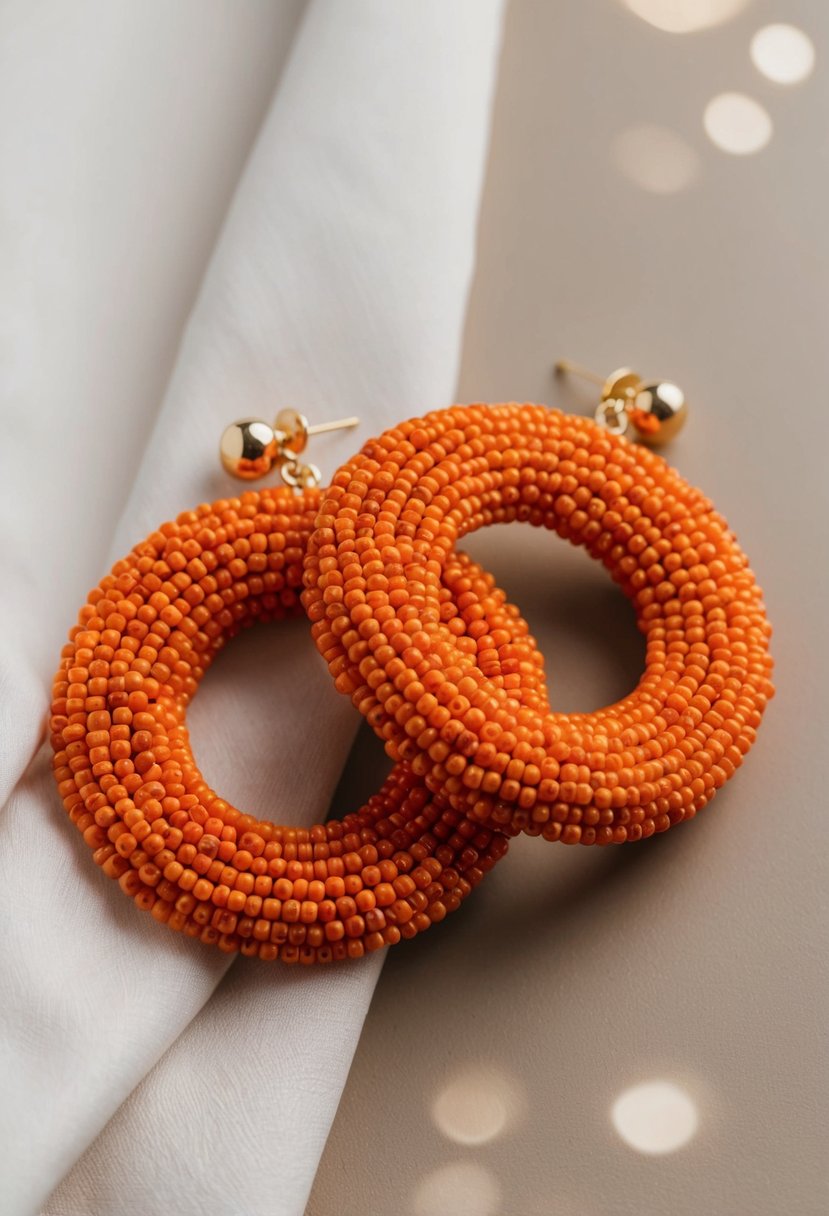 A close-up of bold orange beaded earrings against a soft, neutral background, showcasing intricate details and elegant design